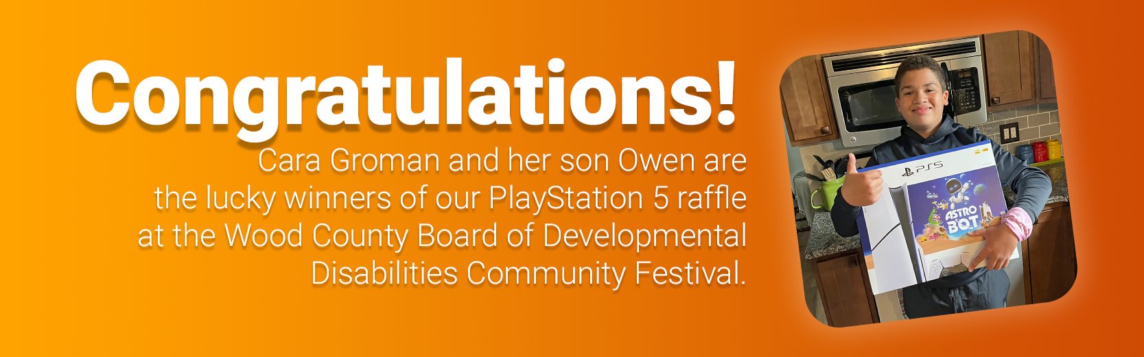 PS5 Winner copy Text Congratulations to Cara Groman and her son Owen with photo of boy holding game system and giving thumbs up